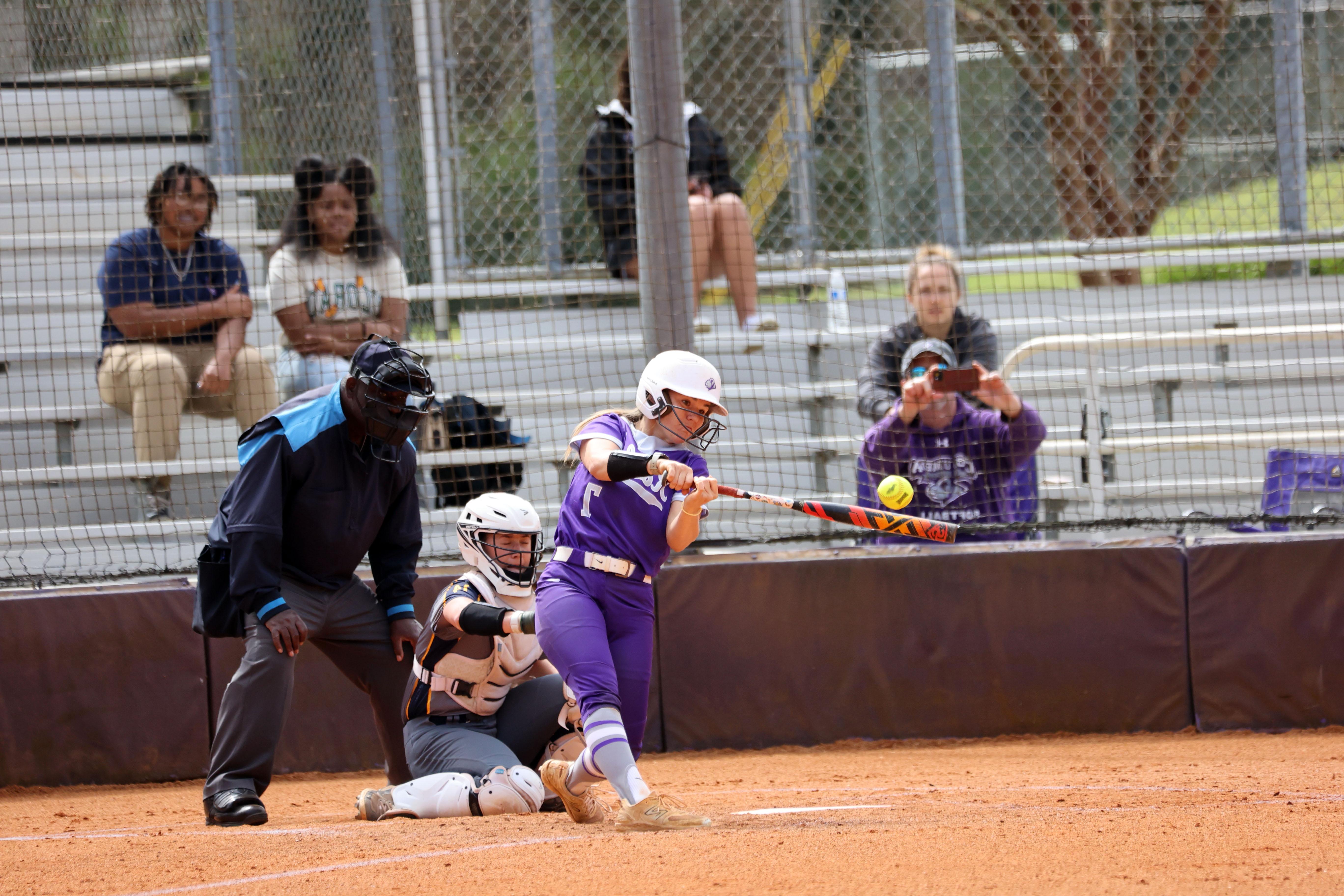 softball player batting